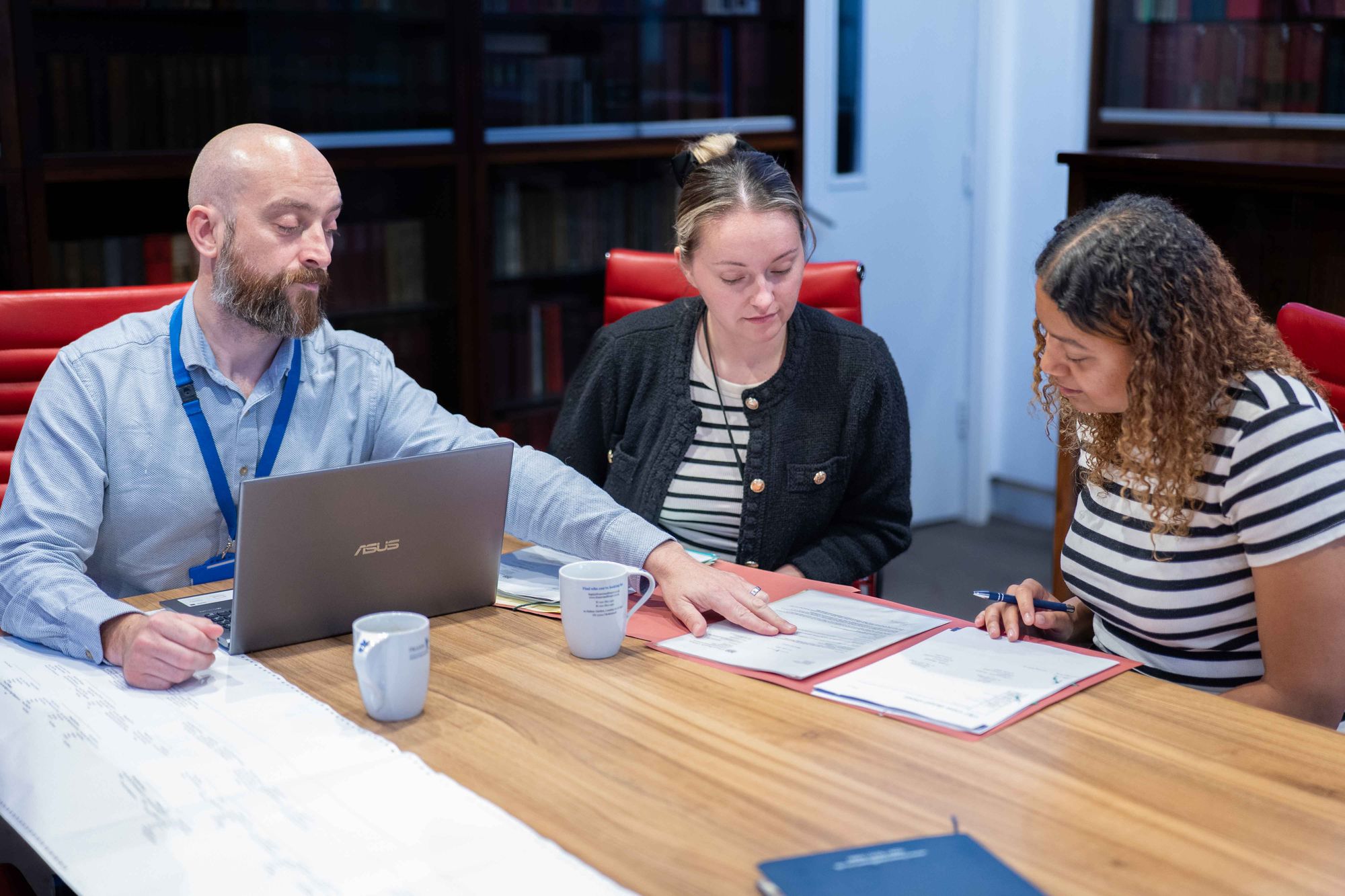 Colleagues discussing family tree research