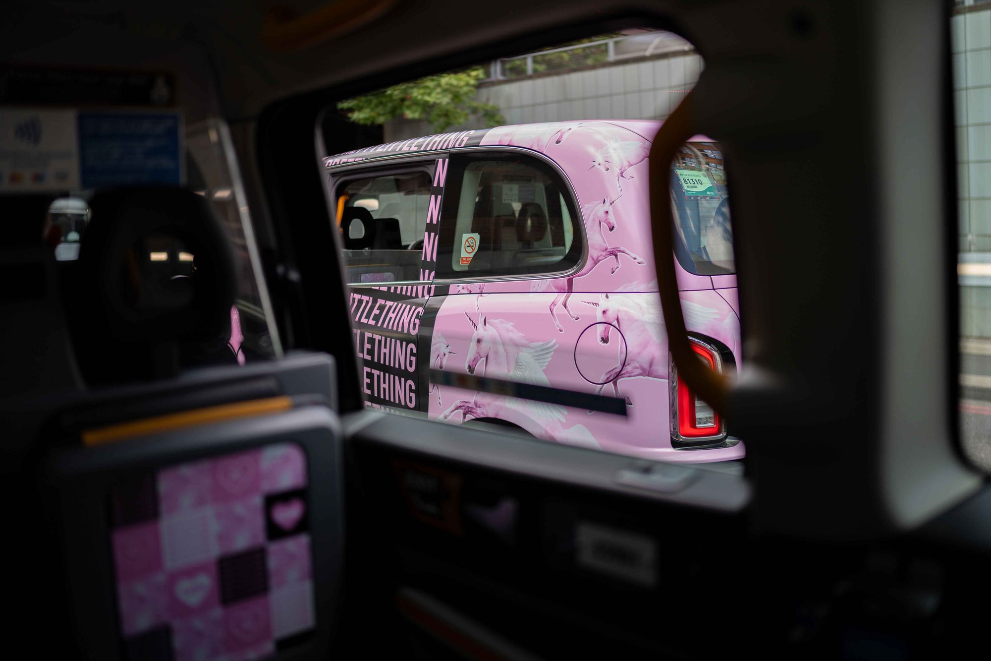 PrettyLittleThing branded pink taxi in front of St Paul's Cathedral